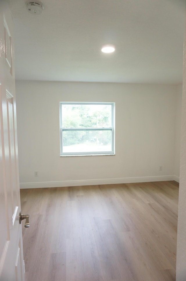 unfurnished room featuring light wood-type flooring