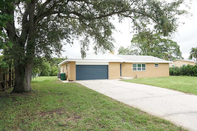 ranch-style home featuring a front yard and a garage