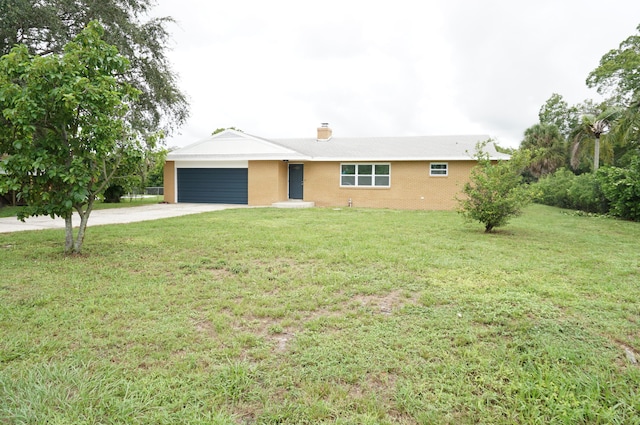 ranch-style home with a front lawn and a garage