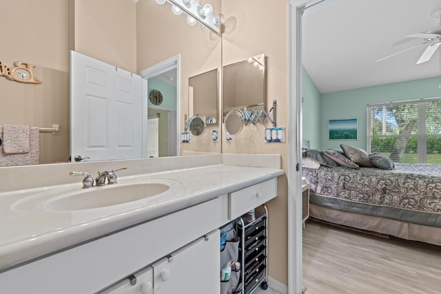 bathroom with vanity, beverage cooler, ceiling fan, and hardwood / wood-style flooring