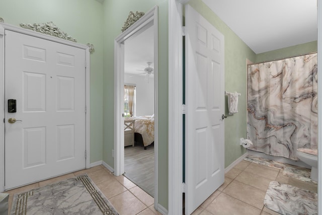 entrance foyer featuring ceiling fan and light tile patterned floors