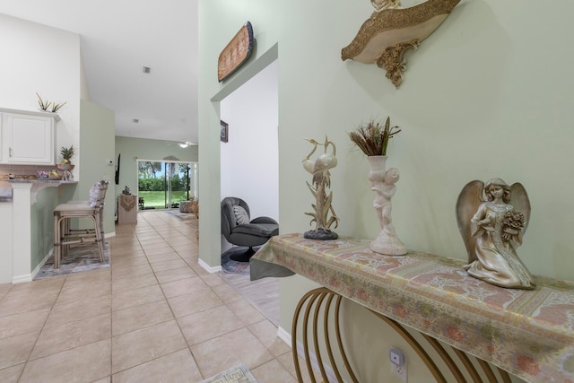 hall featuring light tile patterned floors