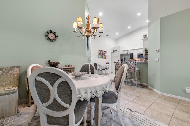 dining area featuring a notable chandelier, light tile patterned floors, and high vaulted ceiling