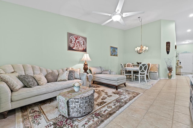 tiled living room featuring ceiling fan with notable chandelier