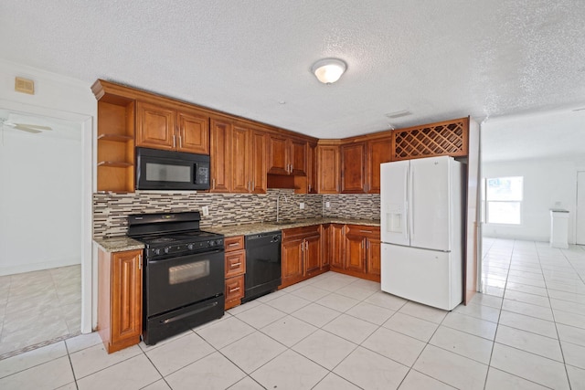 6009 Triphammer Rd, Lake Worth, FL 33463 - kitchen with light stone countertops, a sink, light tile patterned floors, tasteful backsplash, and black appliances
