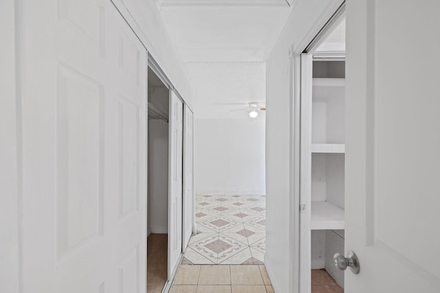 corridor with light tile patterned flooring