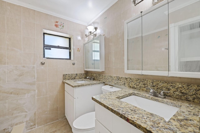 6009 Triphammer Rd, Lake Worth, FL 33463 - full bathroom featuring two vanities, tile walls, toilet, a sink, and crown molding