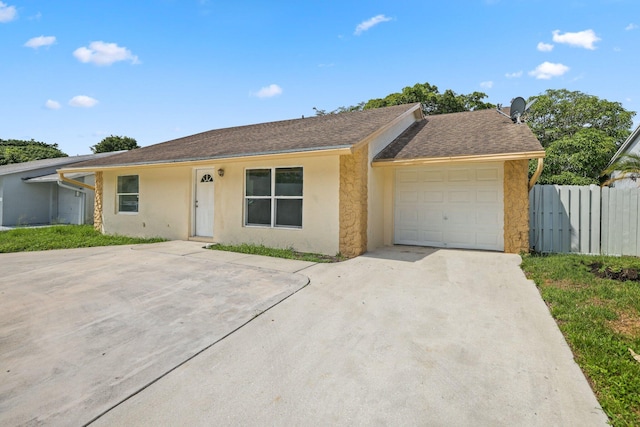 6009 Triphammer Rd, Lake Worth, FL 33463 - ranch-style house with a garage, driveway, roof with shingles, stucco siding, and fence