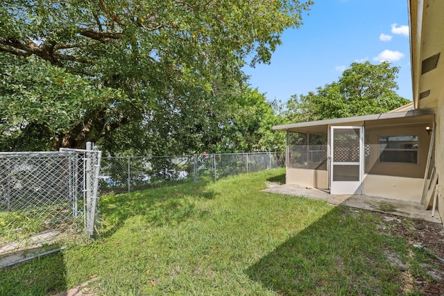6009 Triphammer Rd, Lake Worth, FL 33463 - view of yard with a fenced backyard and a sunroom
