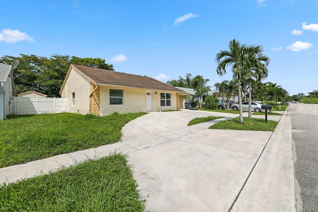 6009 Triphammer Rd, Lake Worth, FL 33463 - single story home with driveway, fence, and stucco siding