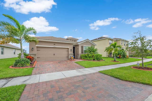 view of front of property with a front lawn and a garage