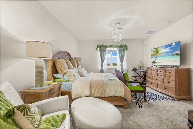 carpeted bedroom with lofted ceiling and a chandelier