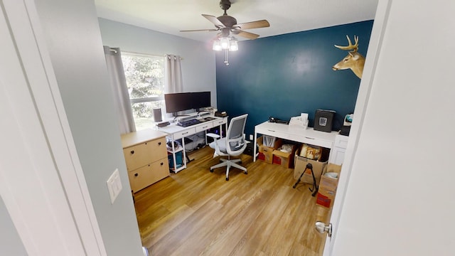 home office featuring light wood-type flooring and ceiling fan