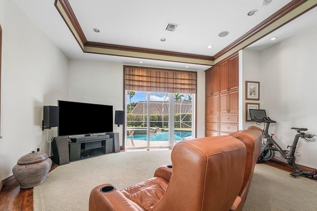 living room with wood-type flooring and ornamental molding