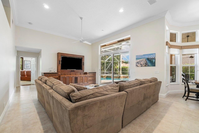 tiled living room with ornamental molding, a textured ceiling, ceiling fan, and a high ceiling