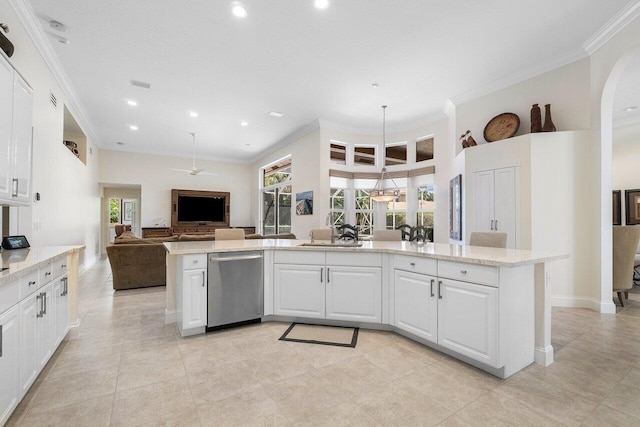 kitchen with stainless steel dishwasher, white cabinets, light stone counters, and ornamental molding