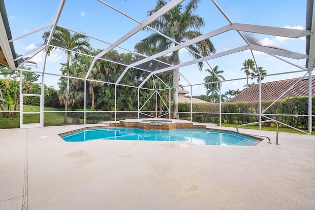 view of swimming pool with glass enclosure and a patio area