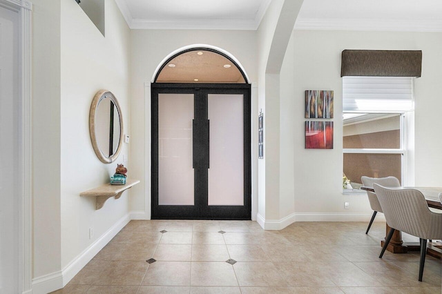 tiled foyer entrance with ornamental molding