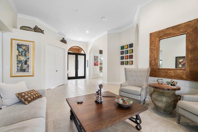 tiled living room with ornamental molding and french doors