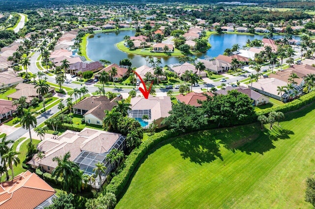 birds eye view of property with a water view