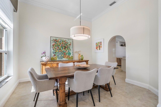 dining area featuring crown molding