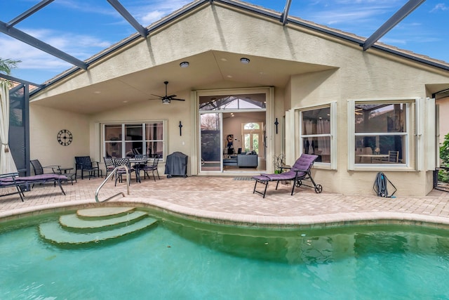 rear view of house featuring a patio, a lanai, and ceiling fan