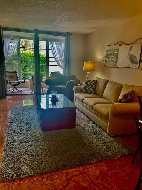 living room featuring tile patterned flooring and a textured ceiling