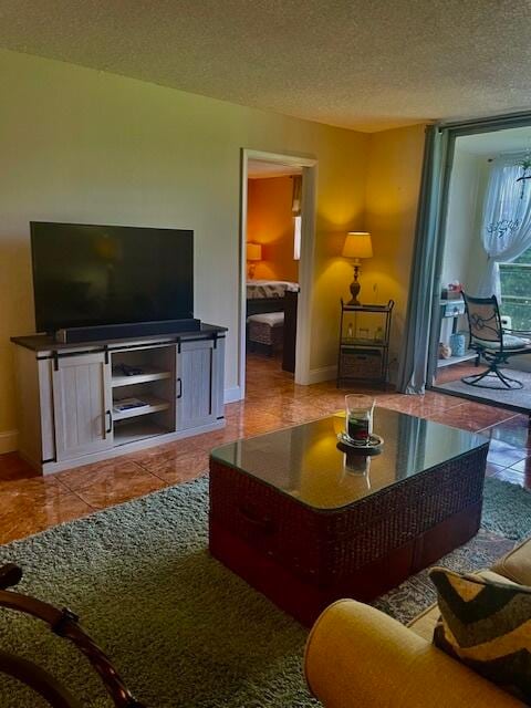 living room featuring a textured ceiling and tile patterned flooring