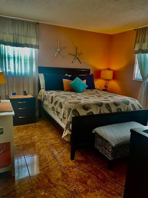 bedroom featuring a textured ceiling