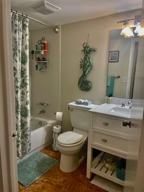 full bathroom with vanity, toilet, and shower / tub combo with curtain