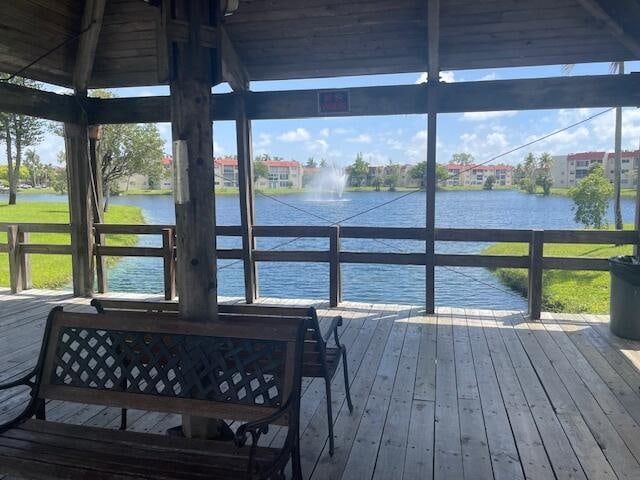 dock area with a water view and a gazebo