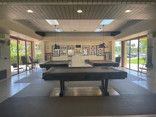 game room with a drop ceiling, tile patterned flooring, and billiards