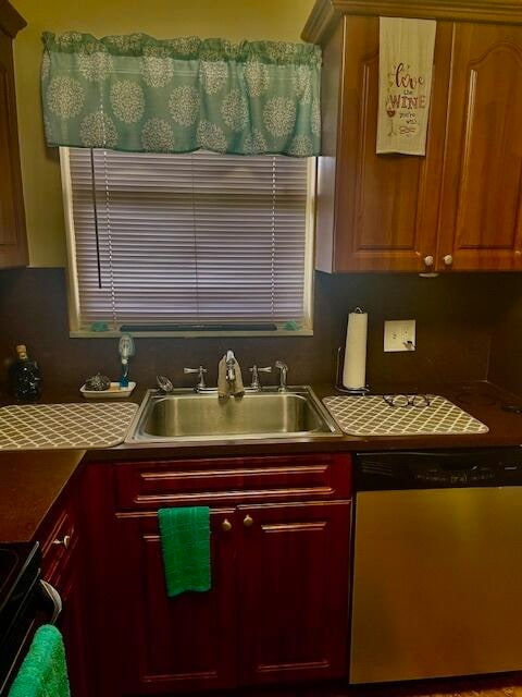 kitchen with stainless steel dishwasher, stove, and sink