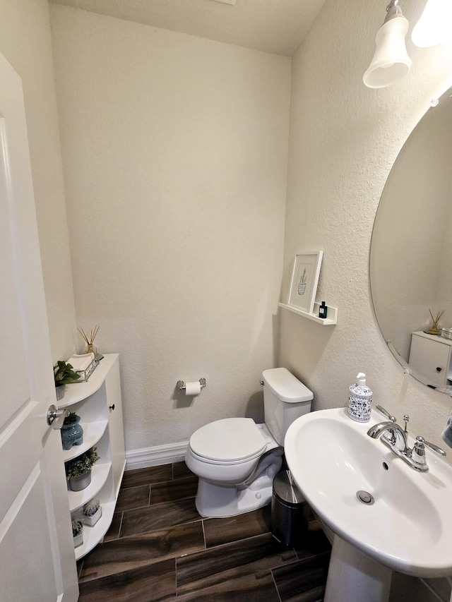 bathroom with sink and toilet