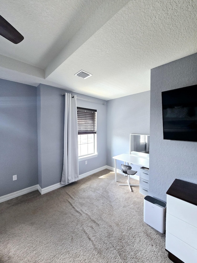 carpeted living room with a textured ceiling