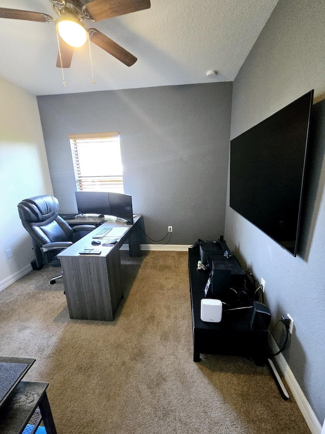 living room featuring a textured ceiling, ceiling fan, and light colored carpet