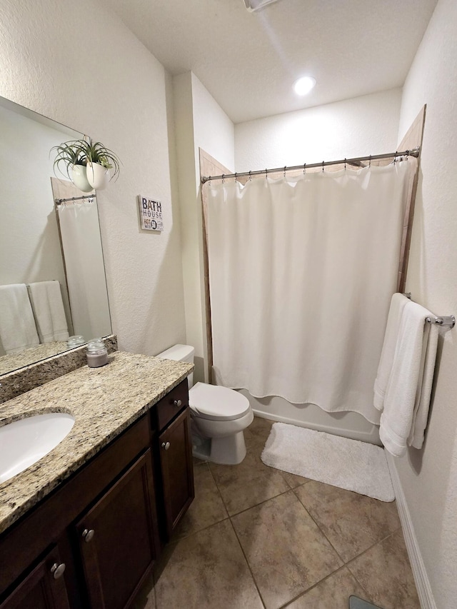 full bathroom with vanity, toilet, shower / bath combo, and tile patterned floors