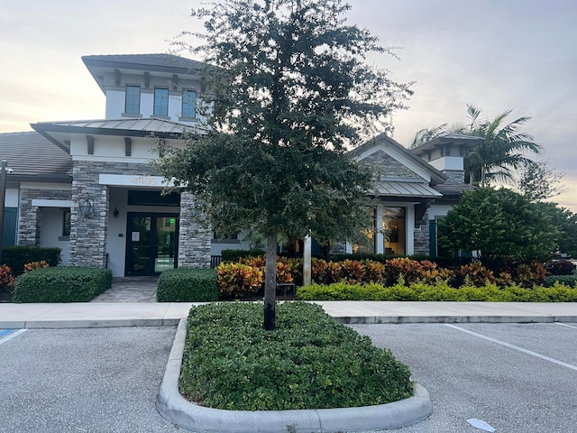 view of outdoor building at dusk