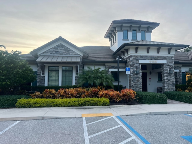 view of outdoor building at dusk