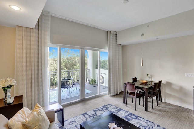 dining room featuring light colored carpet