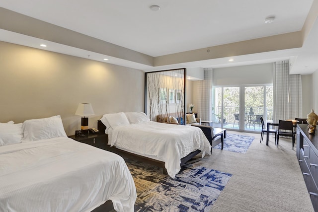 bedroom with dark carpet, french doors, and access to exterior