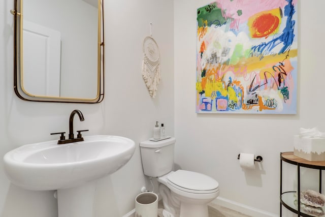 bathroom with sink and toilet