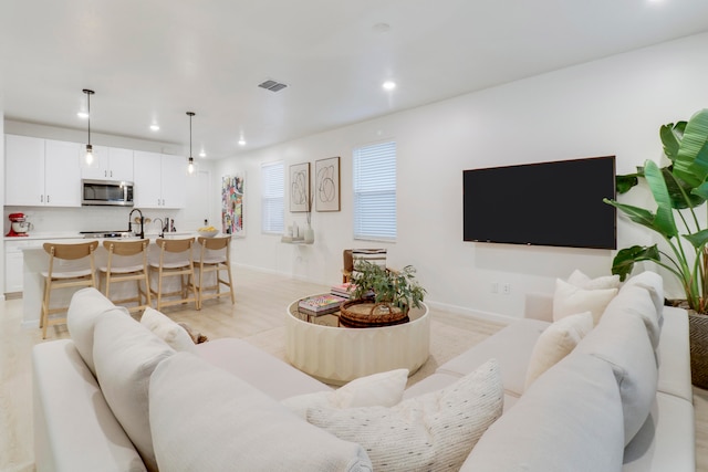 living room with light hardwood / wood-style floors