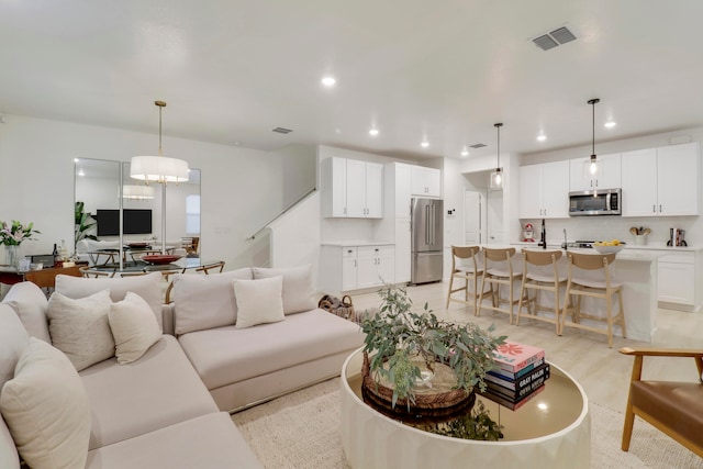 living room with an inviting chandelier