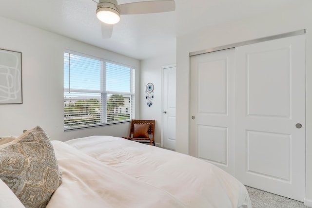 bedroom with light carpet and ceiling fan