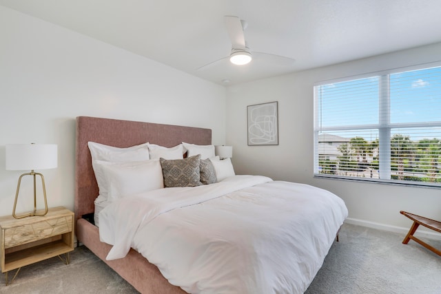 bedroom featuring ceiling fan and carpet