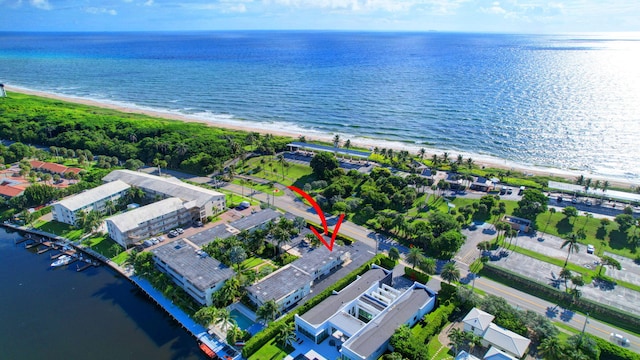 drone / aerial view with a view of the beach and a water view