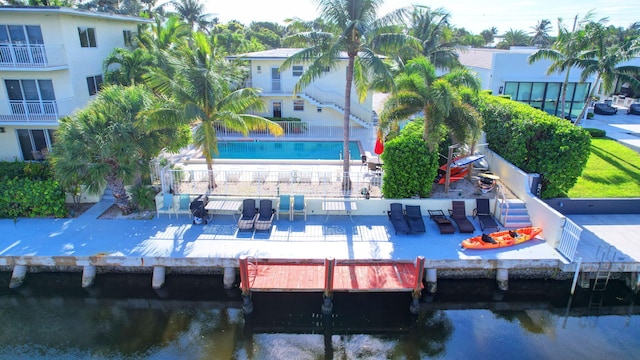 exterior space with a patio and a water view