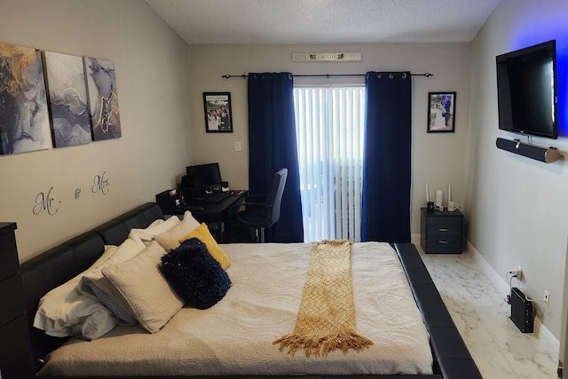 bedroom featuring a textured ceiling