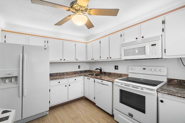 kitchen featuring white cabinetry, white appliances, ceiling fan, light hardwood / wood-style flooring, and sink